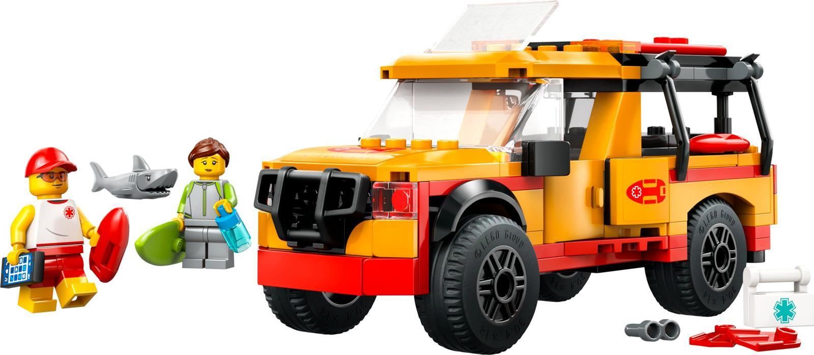 Ein Lego-Rettungsschwimmer-Set mit orange-gelbem Einsatzfahrzeug, zwei Figuren, einem Hai und Zubehör.