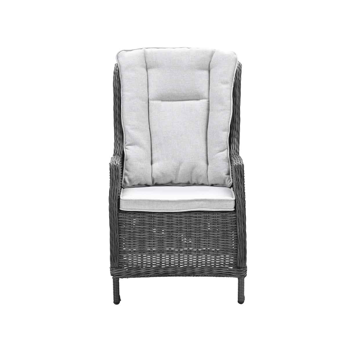 A grey rattan armchair with thick light grey cushions on a white background.
