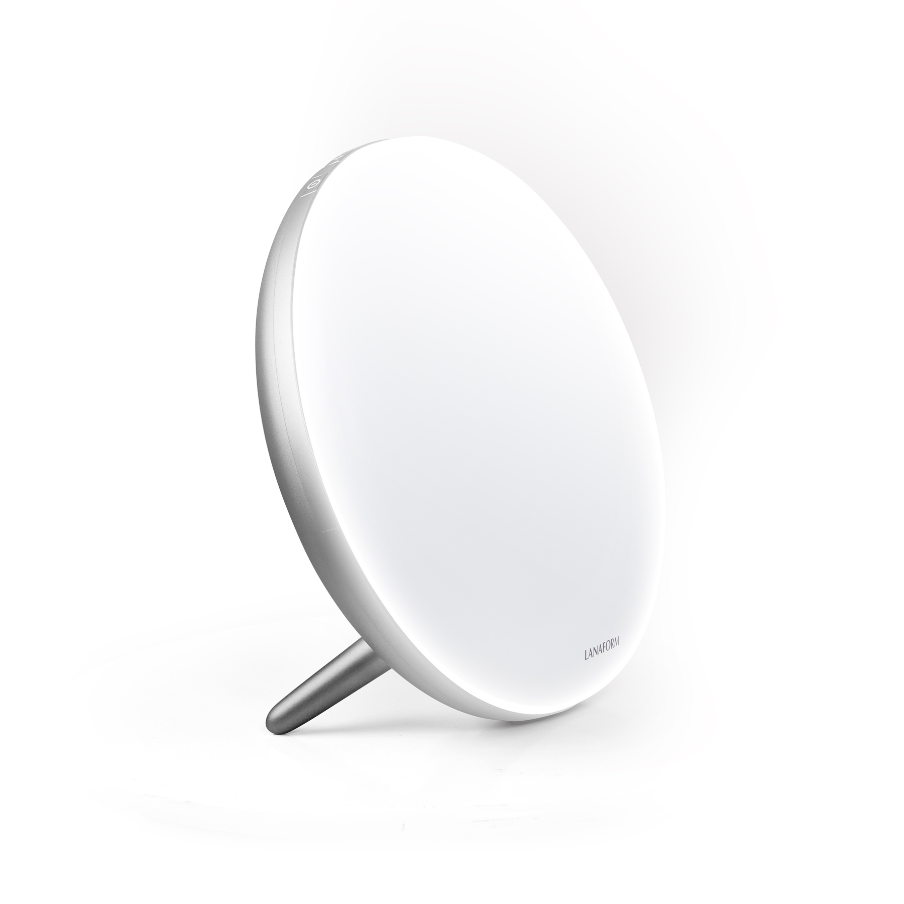 A round, white daylight lamp with a silver rim and stand sits on a white background.