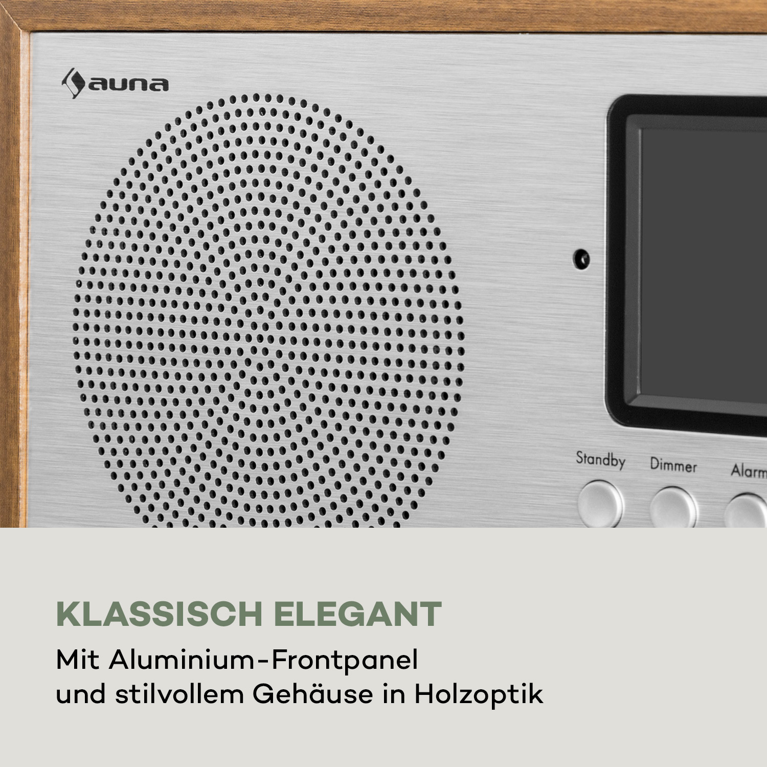 Auna Radio mit silbernem Aluminium-Frontpanel, Lautsprechergitter, Display und Holmenrahmen.