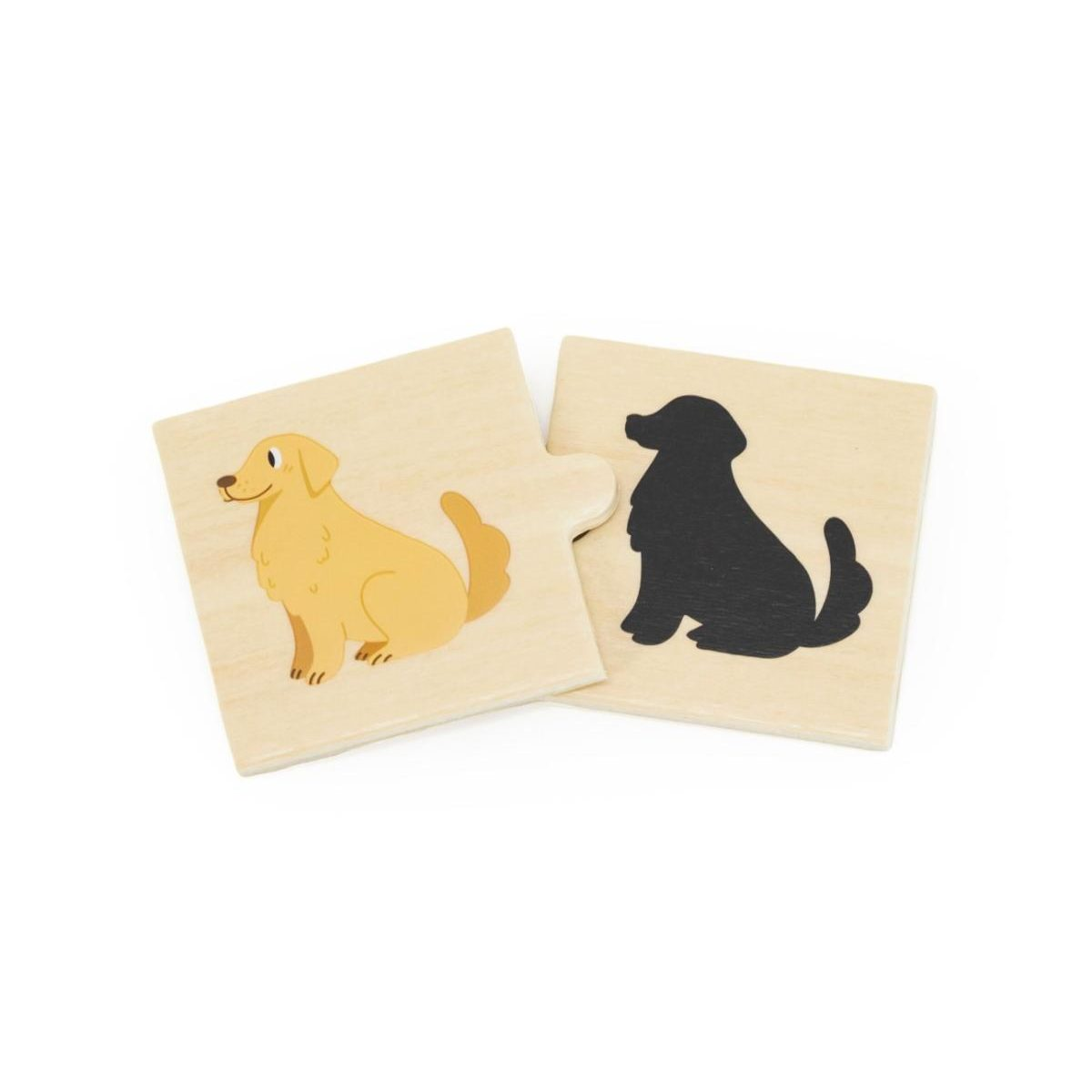 Zwei Holzteile eines Puzzles zeigen einen goldenen Hund und dessen schwarze Silhouette.