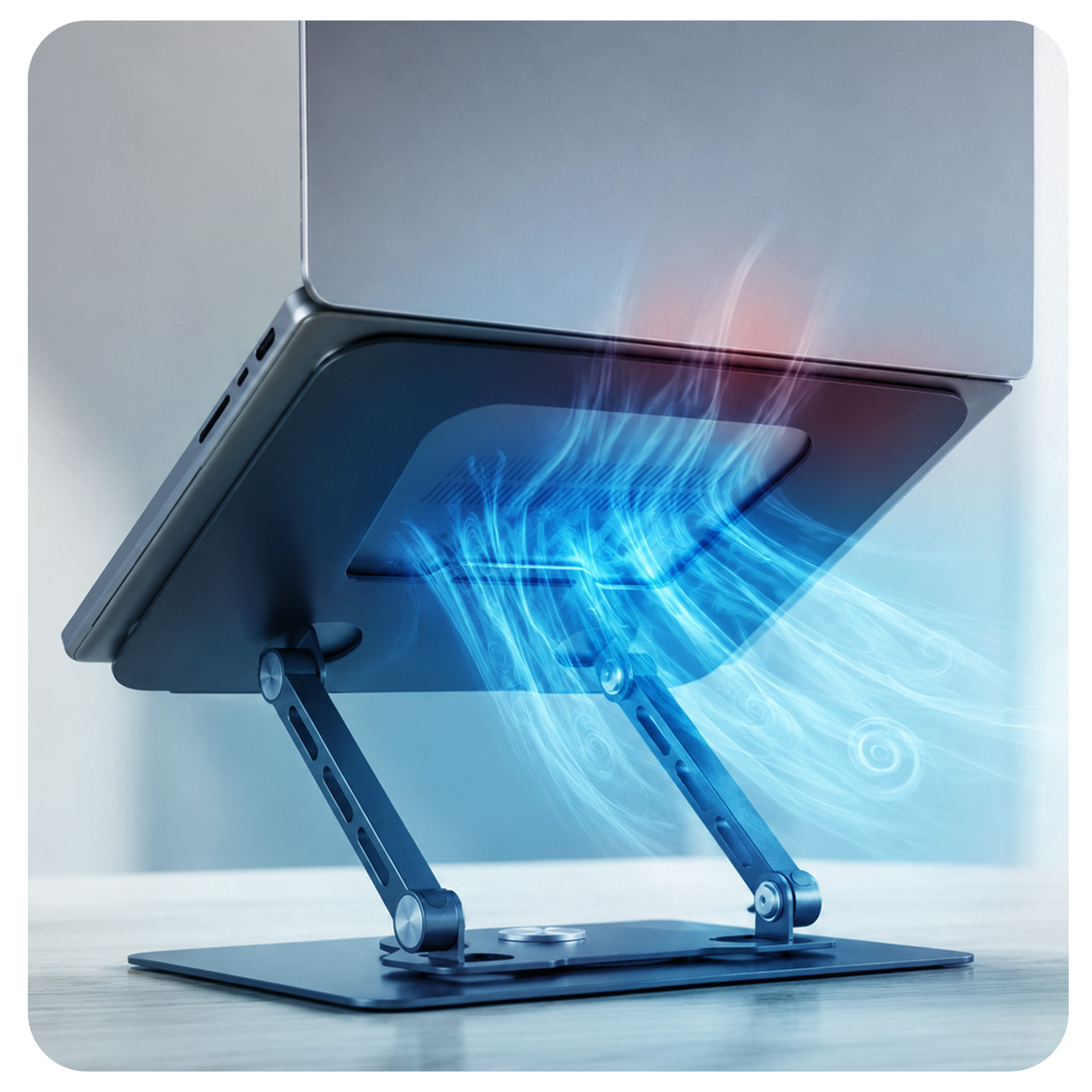 Laptop na regulowanym metalowym stojaku z wirującymi niebieskimi prądami chłodzącymi.