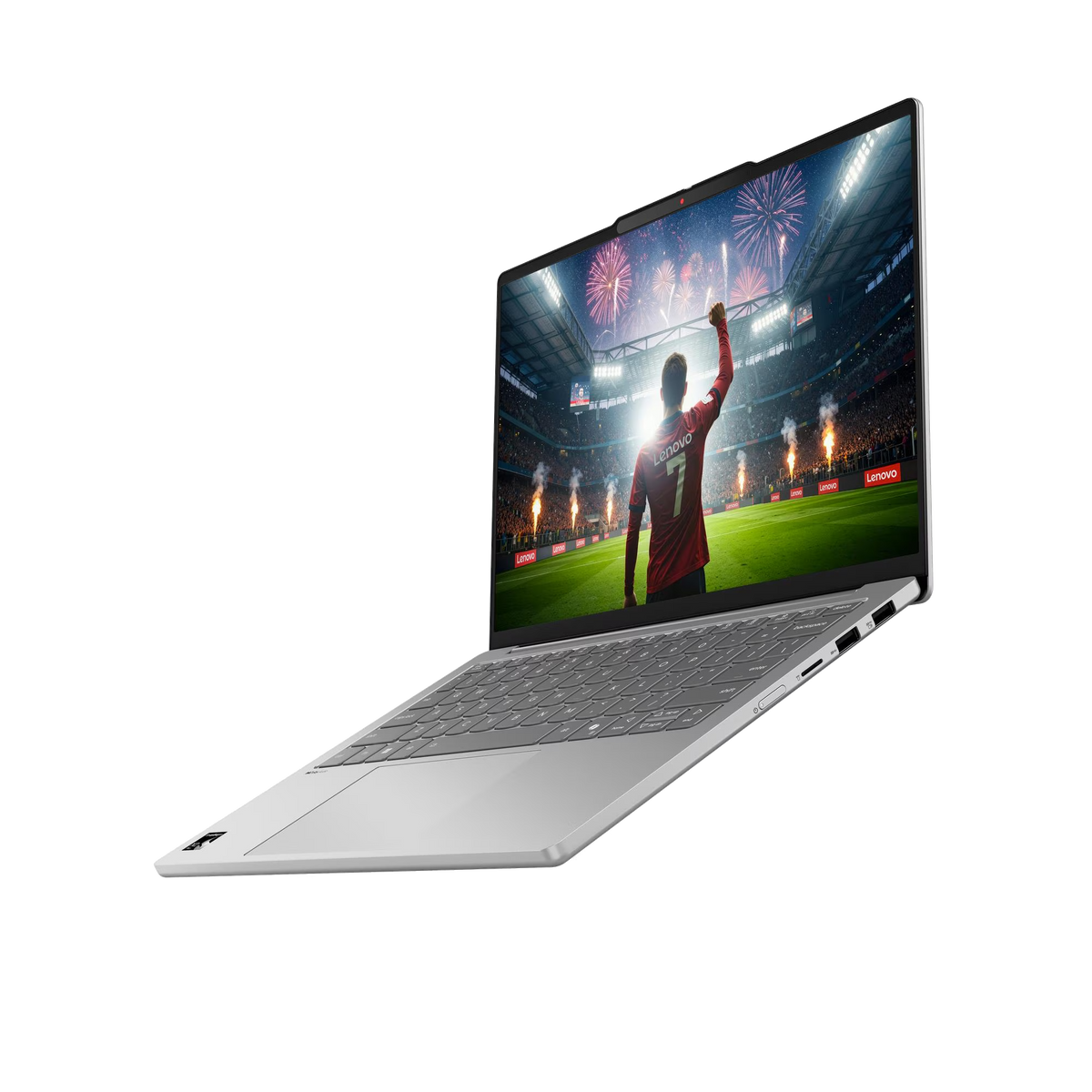 Una laptop plateada está abierta sobre un fondo negro, mostrando a un jugador de fútbol celebrando.