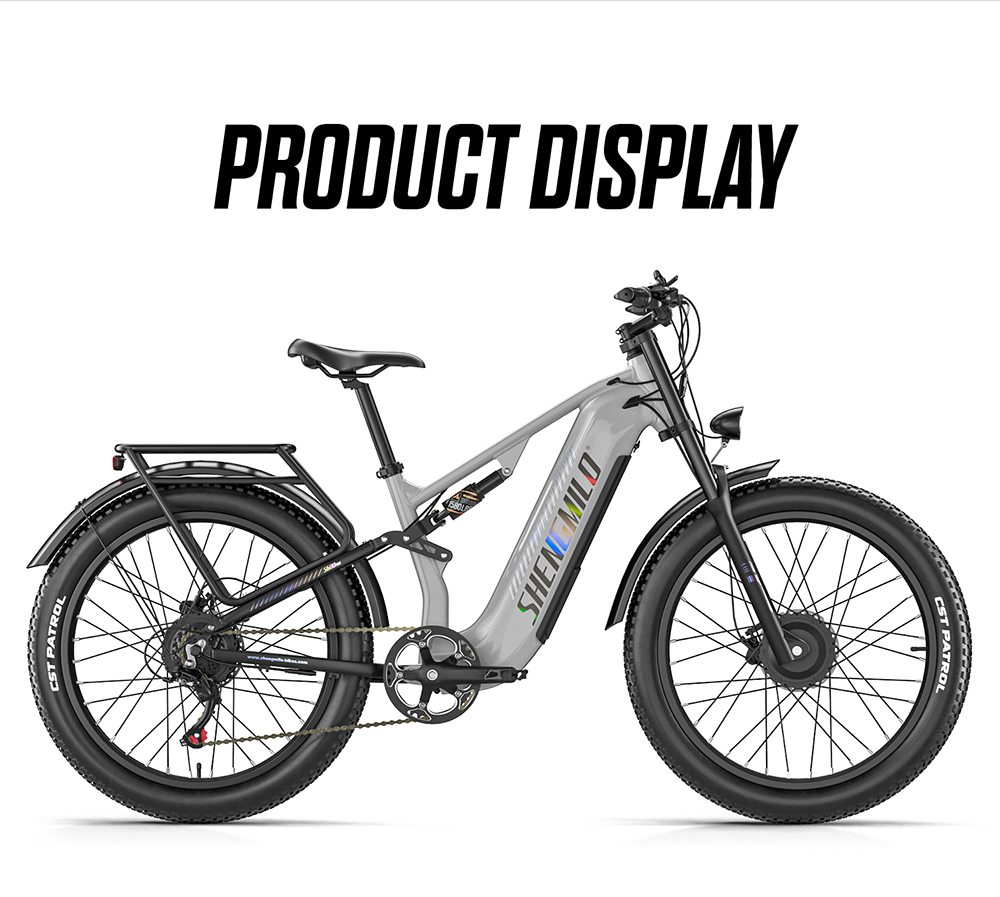 Una mountain bike elettrica grigia Shengmilo con pneumatici larghi e portapacchi su sfondo bianco.