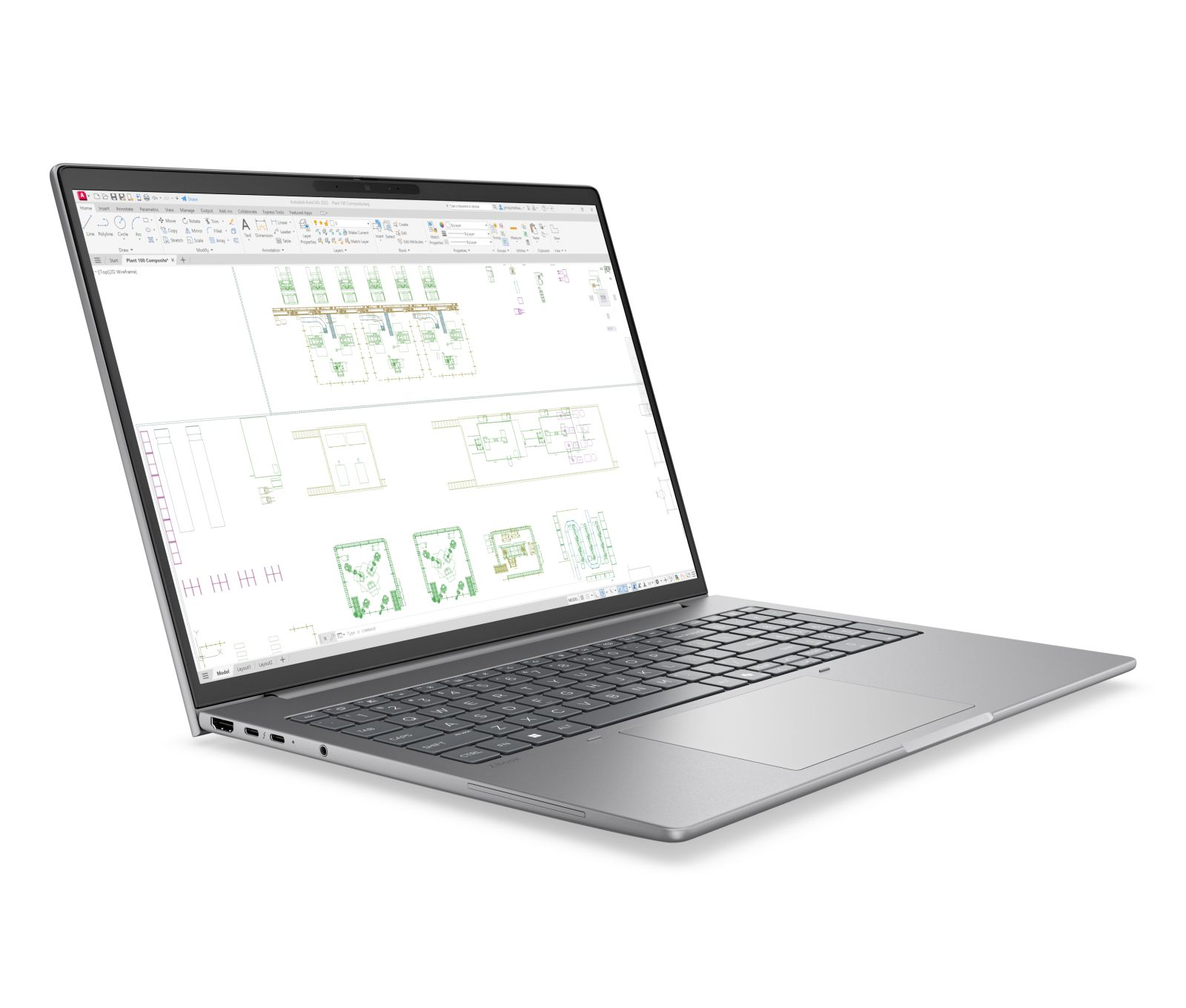 Ein silberner Laptop auf weißem Hintergrund zeigt CAD-Software mit technischen Zeichnungen auf dem Bildschirm.