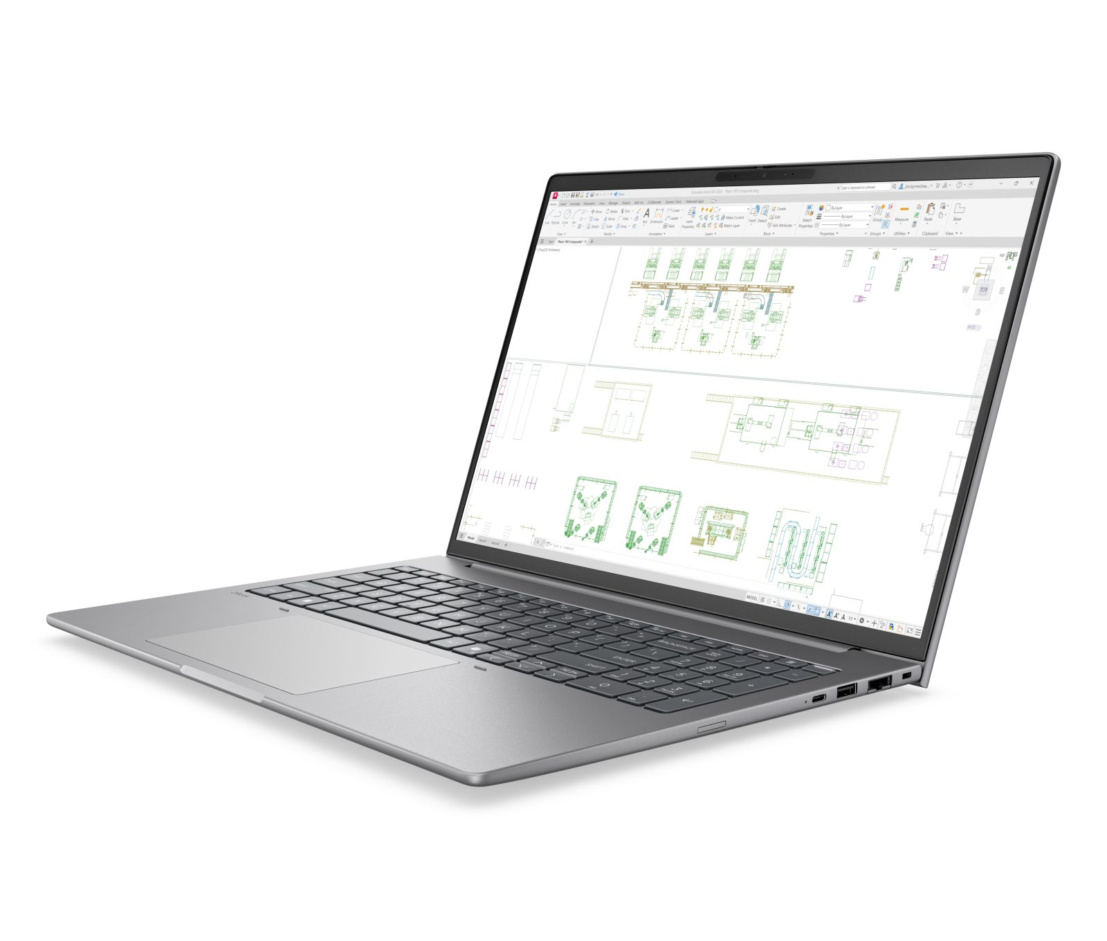 Ein silberner Laptop auf weißem Hintergrund zeigt CAD-Zeichnungen auf dem Bildschirm.