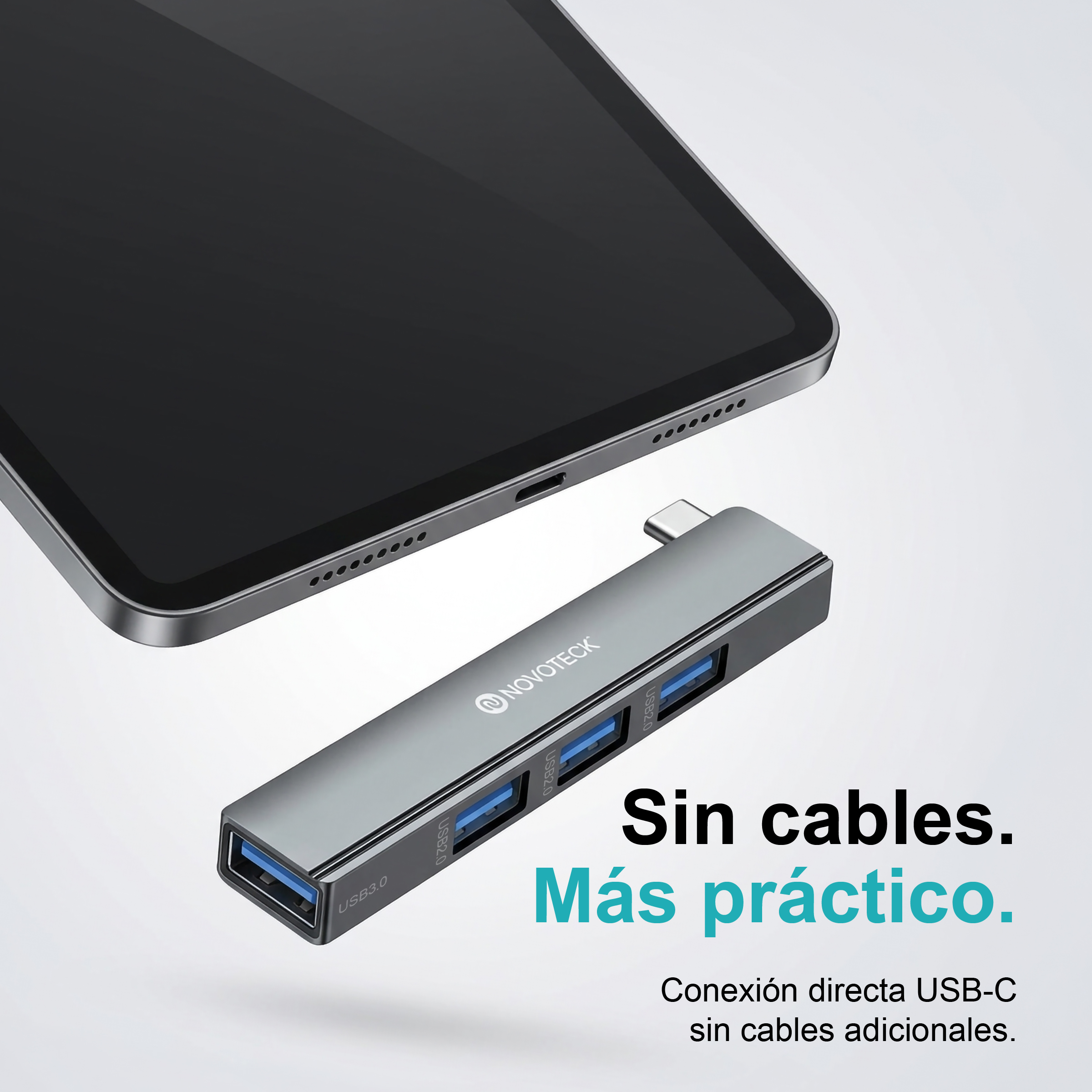 Hub USB-C gris de varios puertos junto a una tableta, con texto publicitario en español.