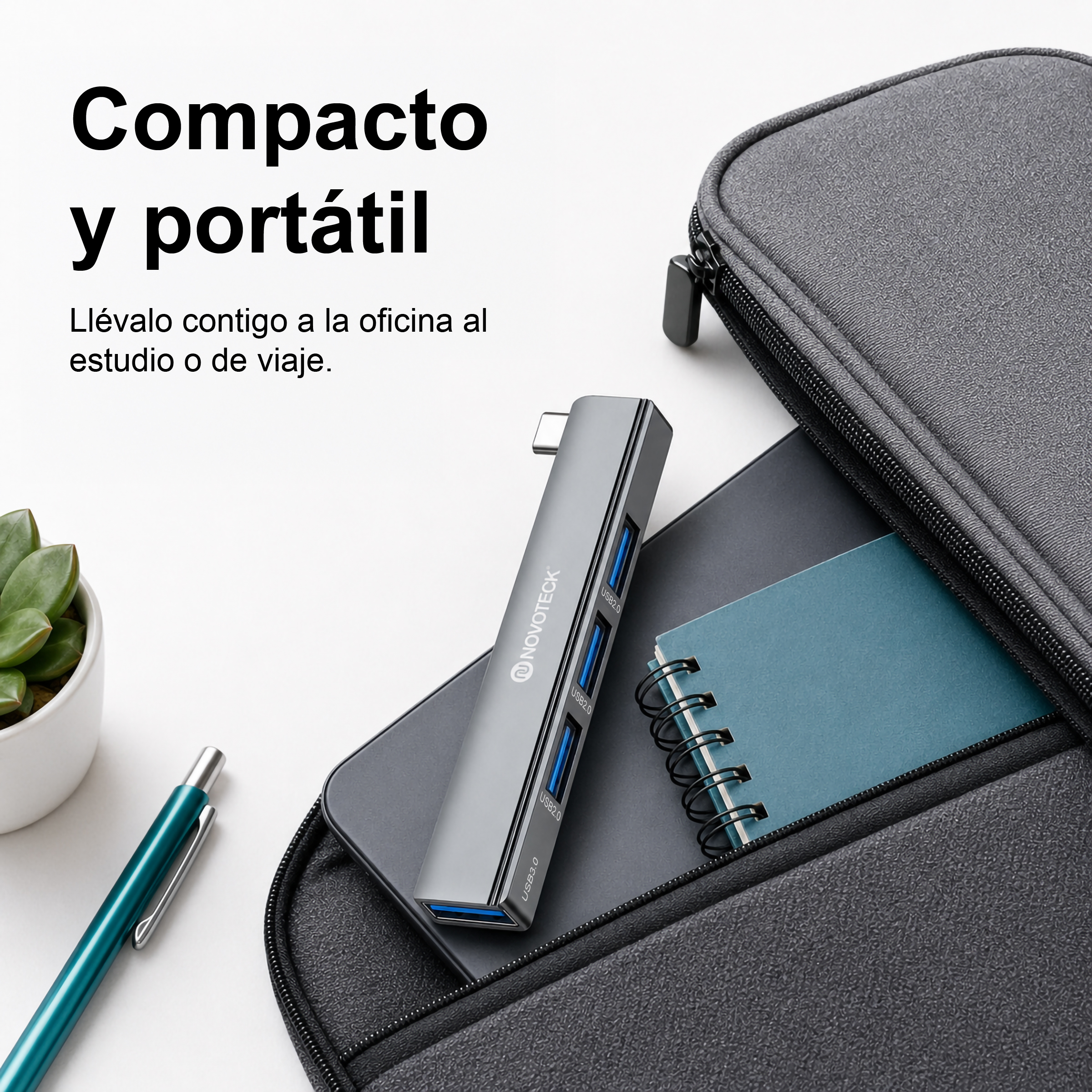 Un concentrador USB gris junto a un cuaderno en un estuche negro, con texto en español.