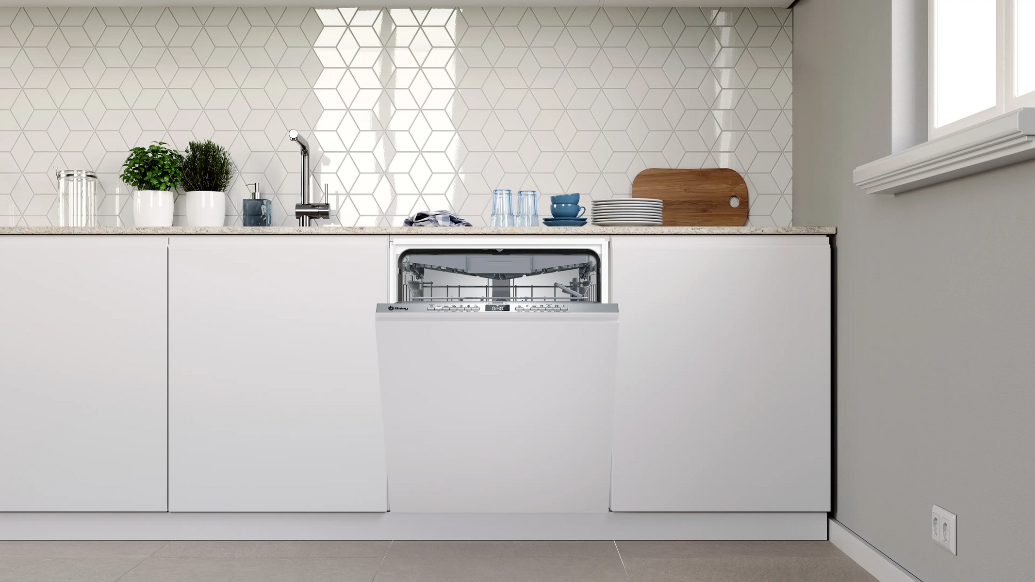 Cocina moderna con lavavajillas blanco abierto integrado, azulejos blancos y encimera con elementos decorativos.