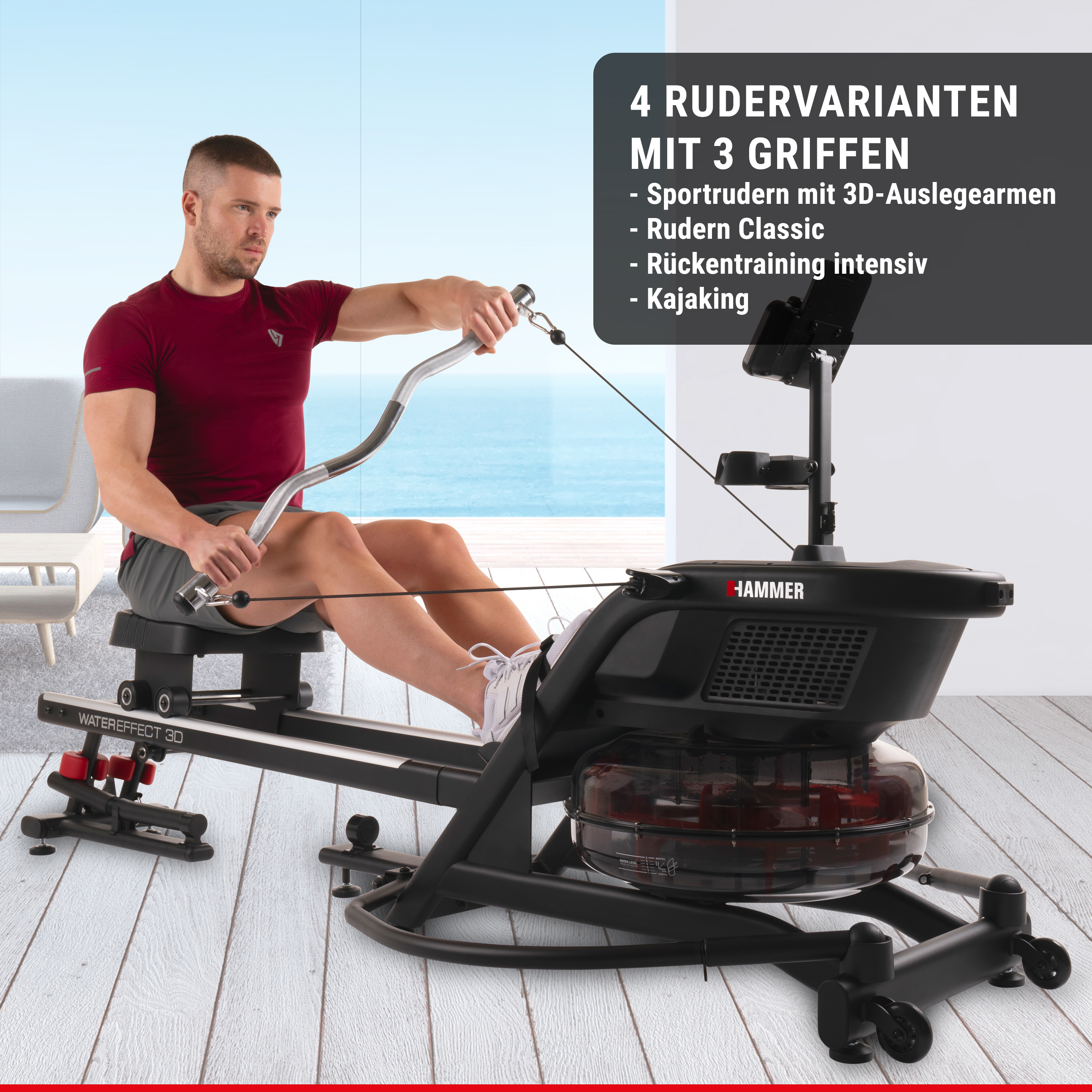 Ein Mann trainiert auf einem Hammer-Wasserrudergerät in einem hellen Raum vor einem großen Fenster.