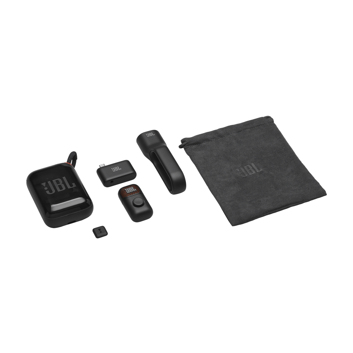 Set de micrófono JBL negro con estuche, receptor, transmisor, clip y accesorios sobre fondo negro.