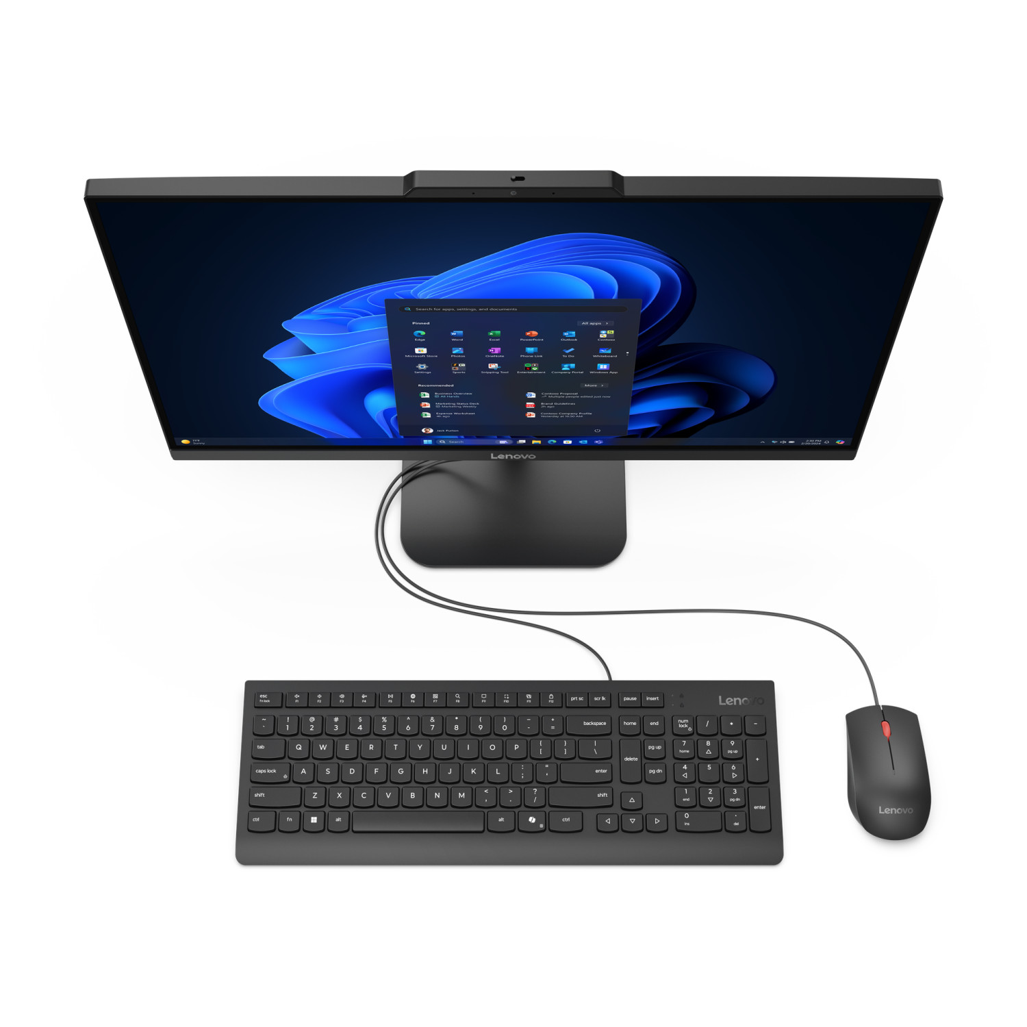 Un PC all-in-one Lenovo visto dall'alto con tastiera, mouse e interfaccia Windows blu.