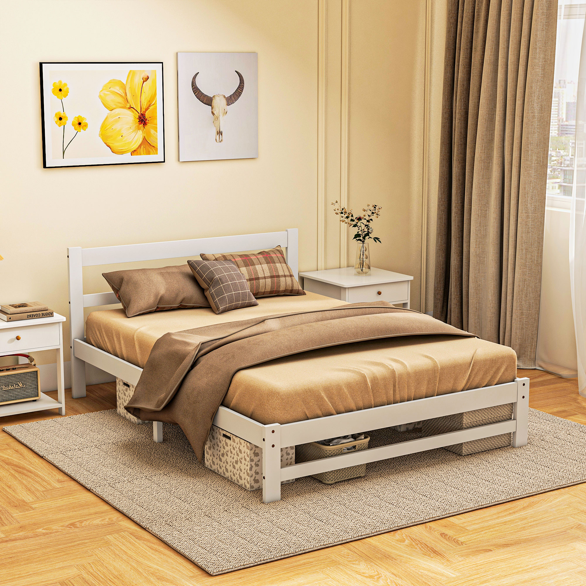 Una cama de madera blanca con ropa de cama beige, cajas de almacenamiento debajo y dos mesitas de noche.
