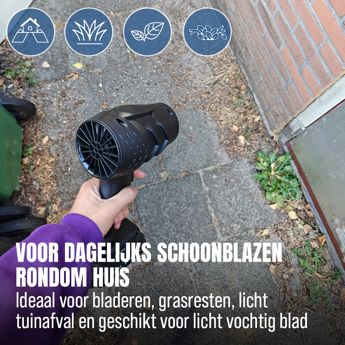 A hand holding a black leaf blower outdoors with text overlay in Dutch.