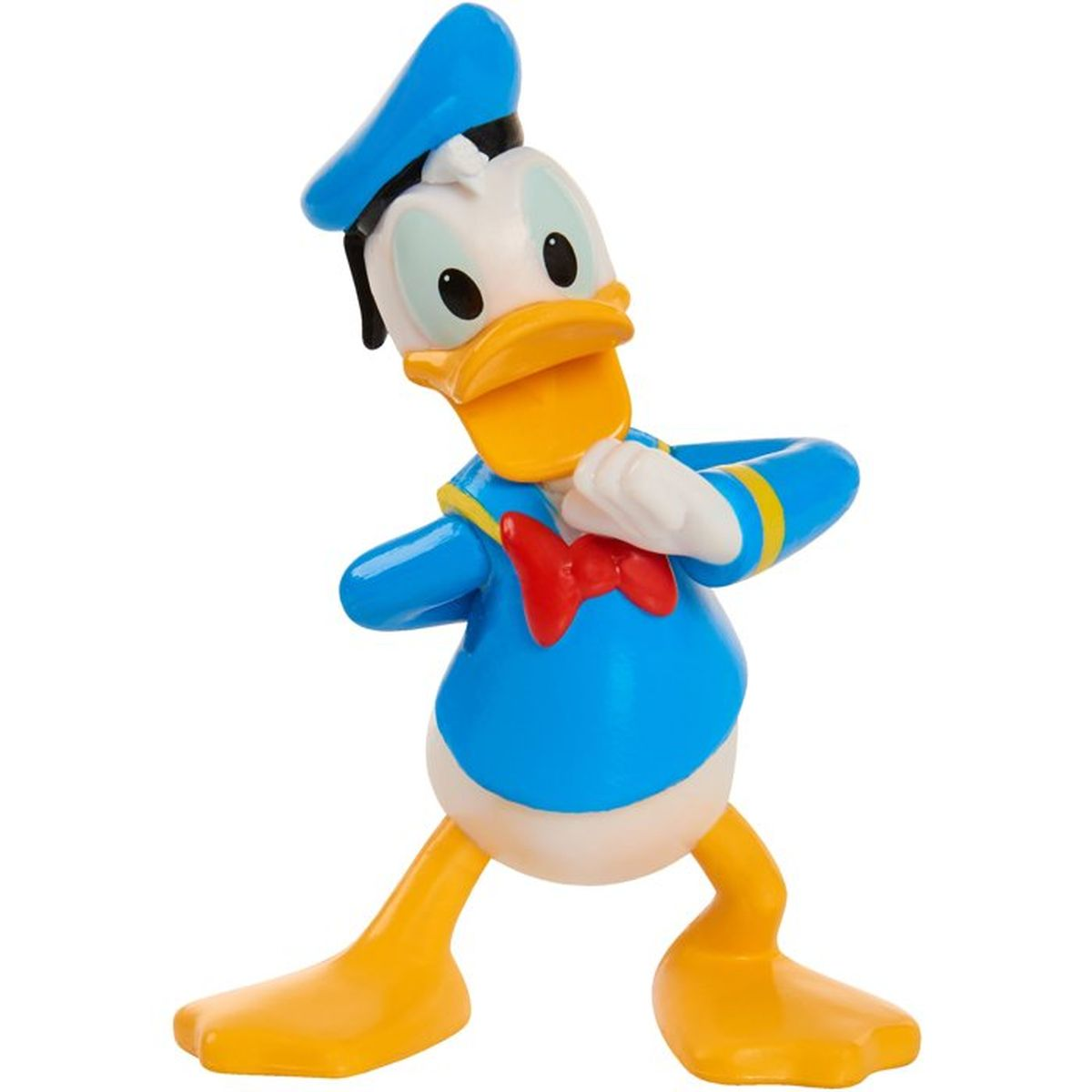 Eine Kunststofffigur von Donald Duck in seinem blauen Matrosenhemd, Mütze und roter Fliege vor weißem Hintergrund.