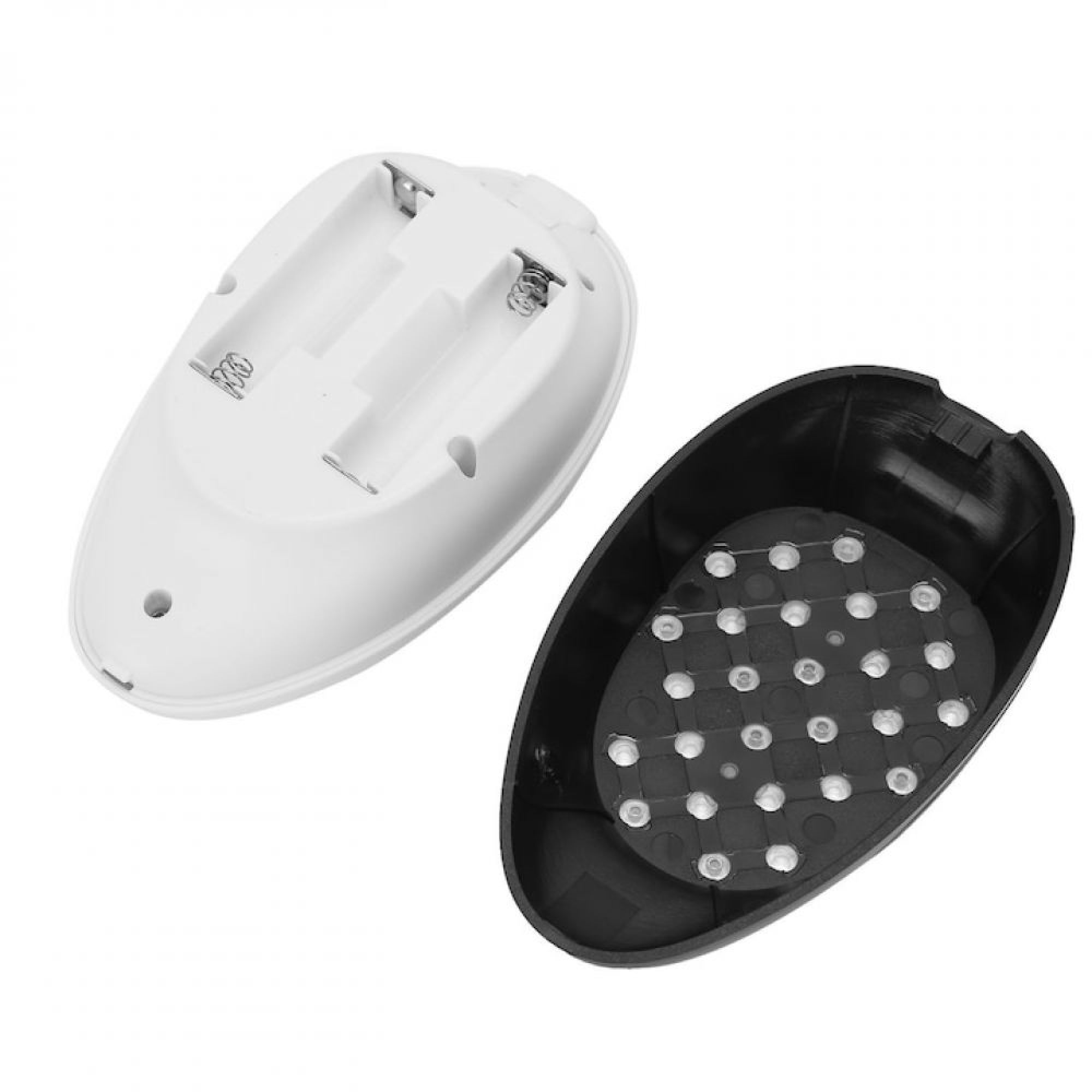 Ein weißes Plastikgerät mit Batteriefach und ein separates schwarzes Teil mit vielen kleinen runden LEDs im Inneren.