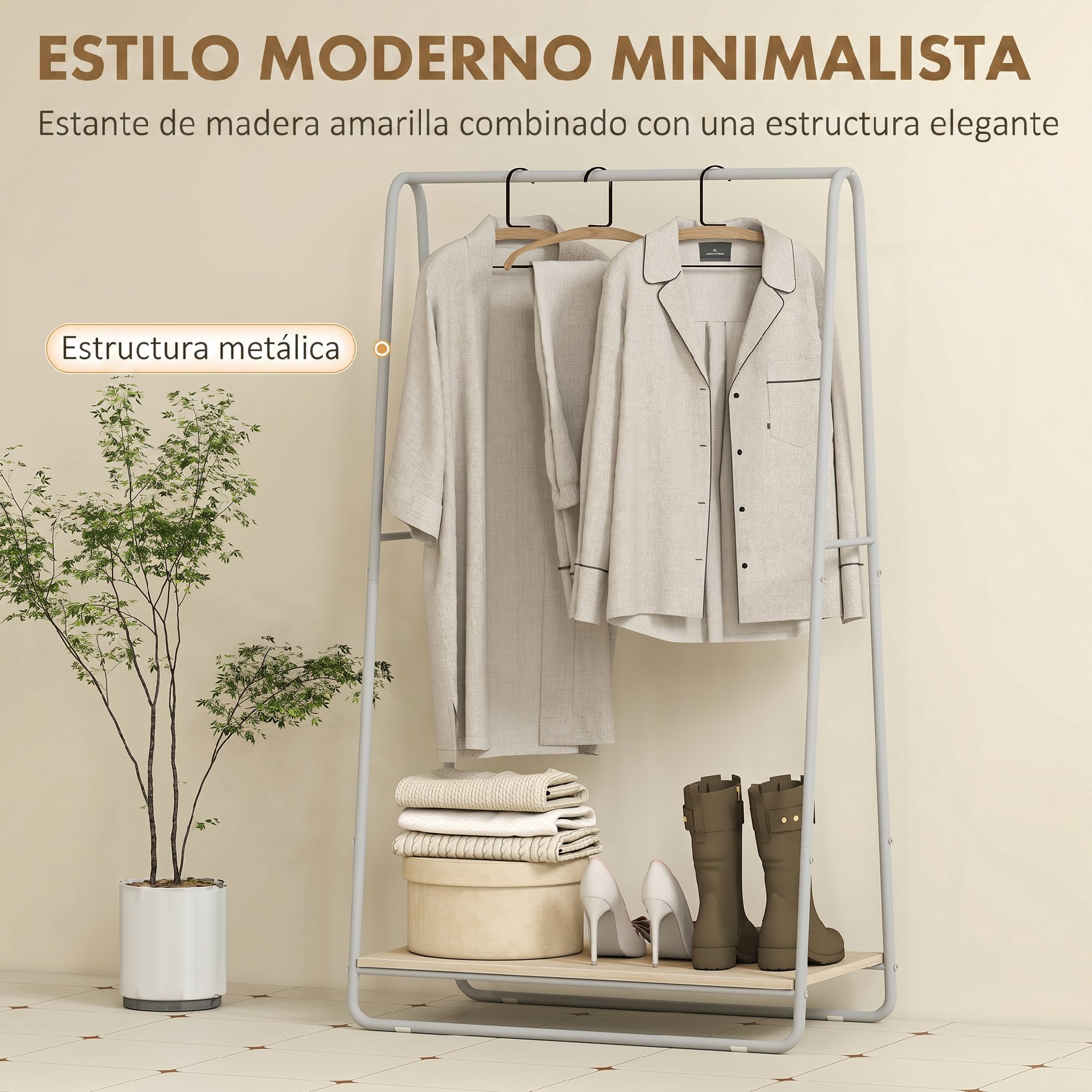 Un perchero de metal gris claro sostiene pijamas beiges y una bata, con textiles doblados, botas y una planta.