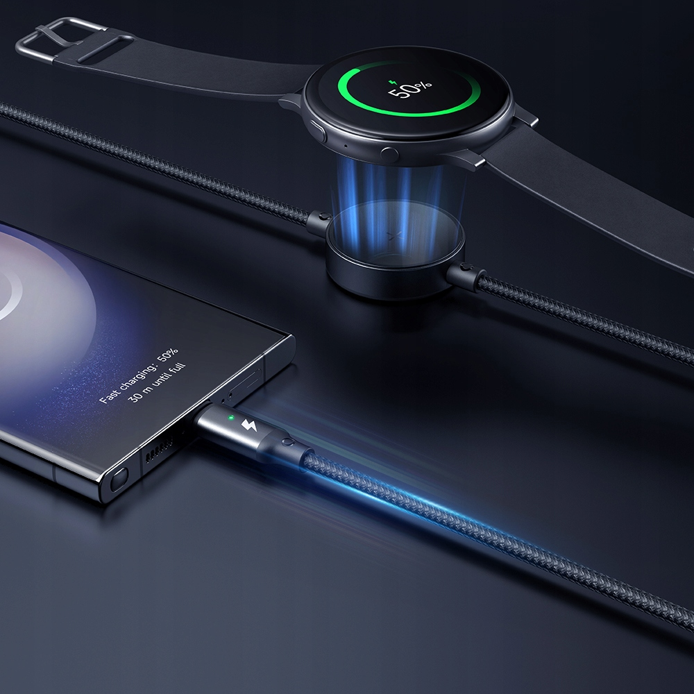 Smartphone e smartwatch in carica wireless e via cavo su una stazione di carica blu su sfondo scuro.