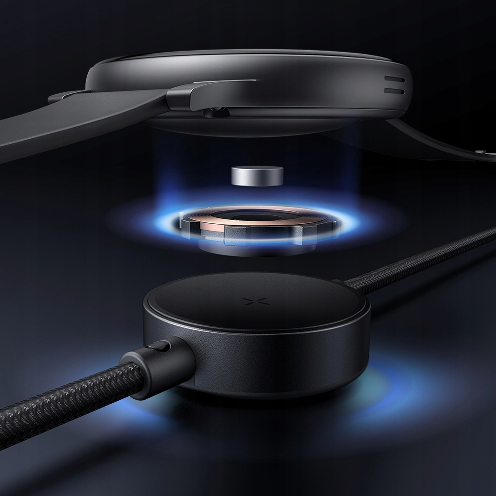 Uno smartwatch nero fluttua sopra una base di ricarica magnetica con luce blu.