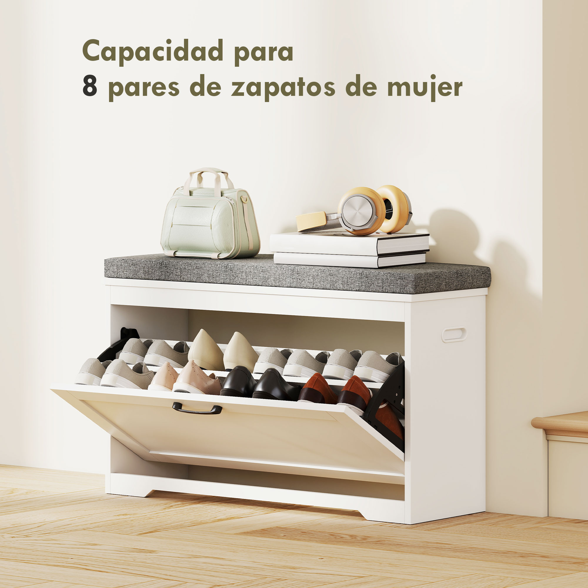 Banco zapatero blanco con cojín gris, lleno de zapatos, un bolso y auriculares encima.