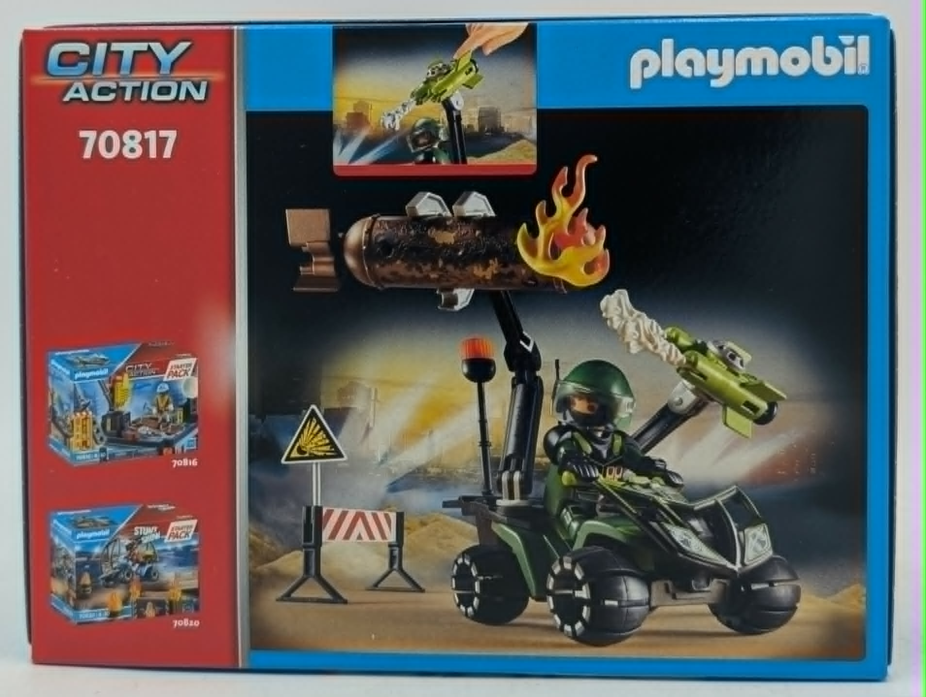 Set Playmobil City Action 70817 con quad verde, figura, cohete y señal de advertencia.