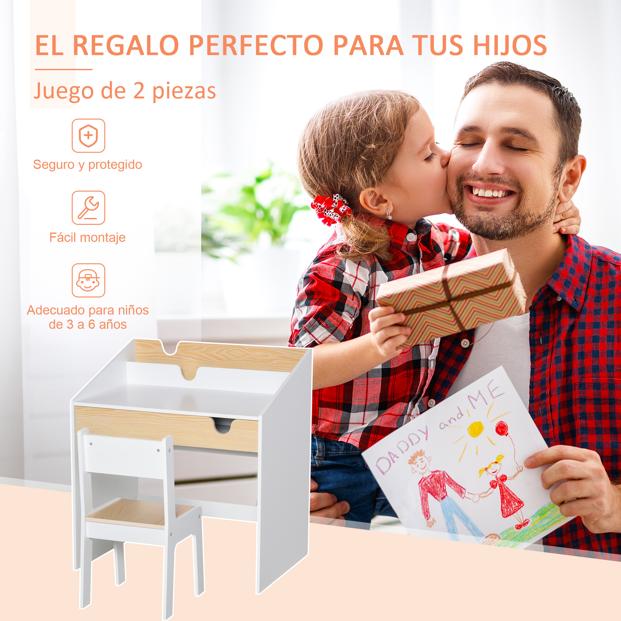 Una niña besa a su padre sonriente mientras sostiene un regalo, con un juego de escritorio infantil abajo.