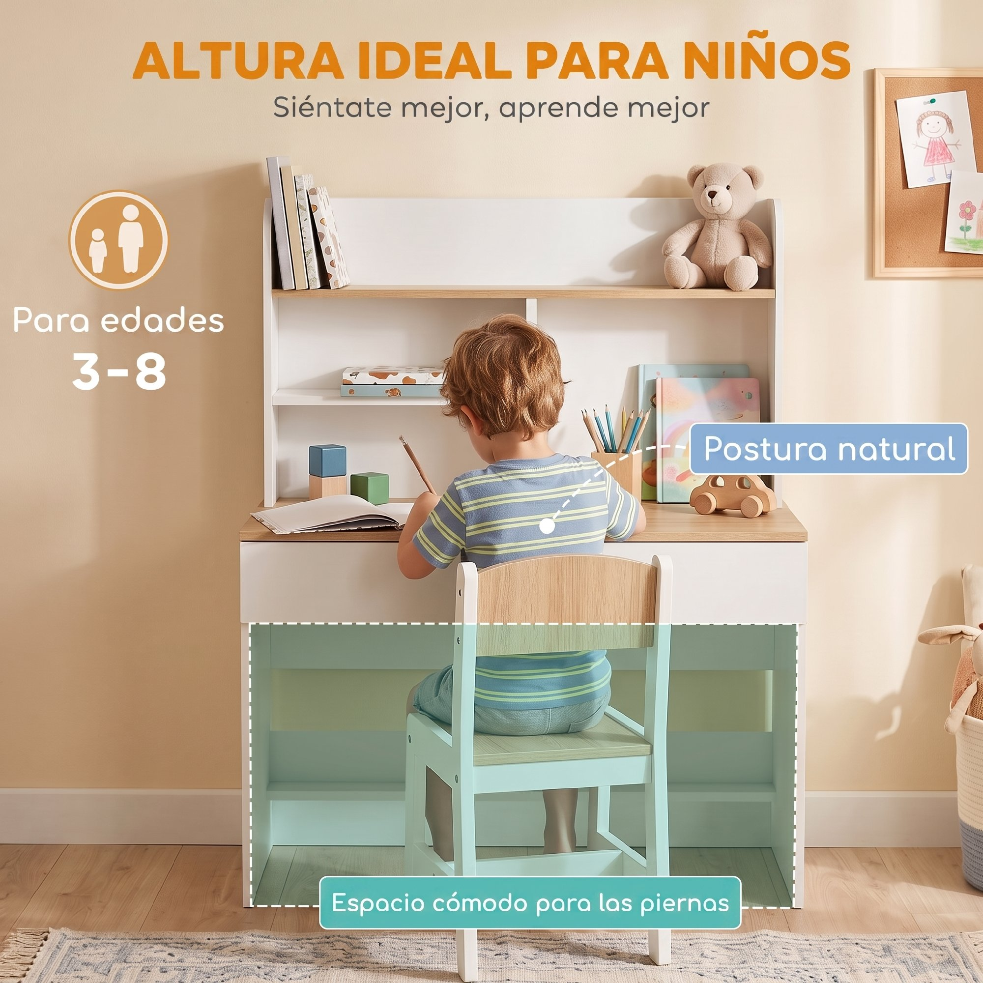 Un niño está sentado en un escritorio infantil blanco con silla y dibuja en un cuaderno.