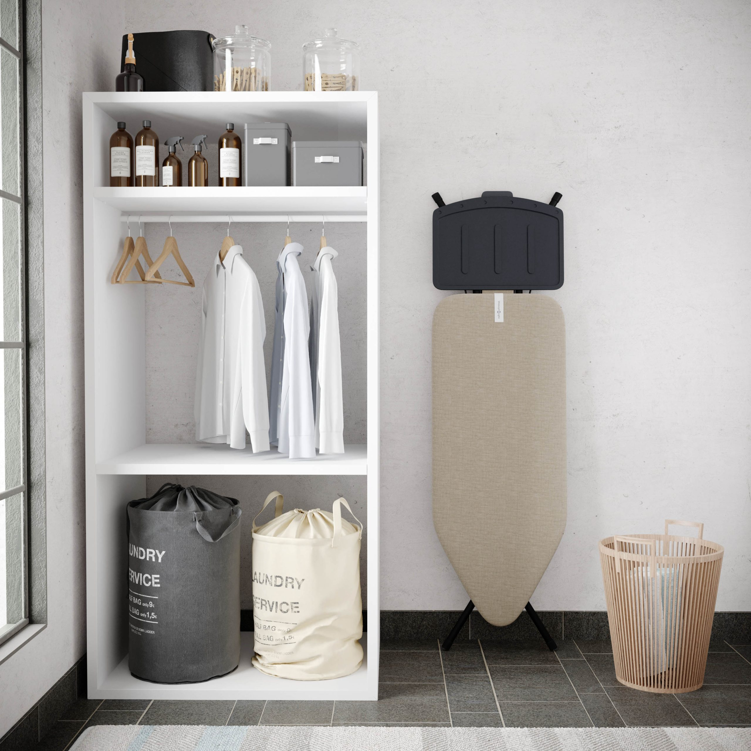 A white laundry shelf with clothes, bottles, and bags, alongside a wall-mounted ironing board and a wooden basket.