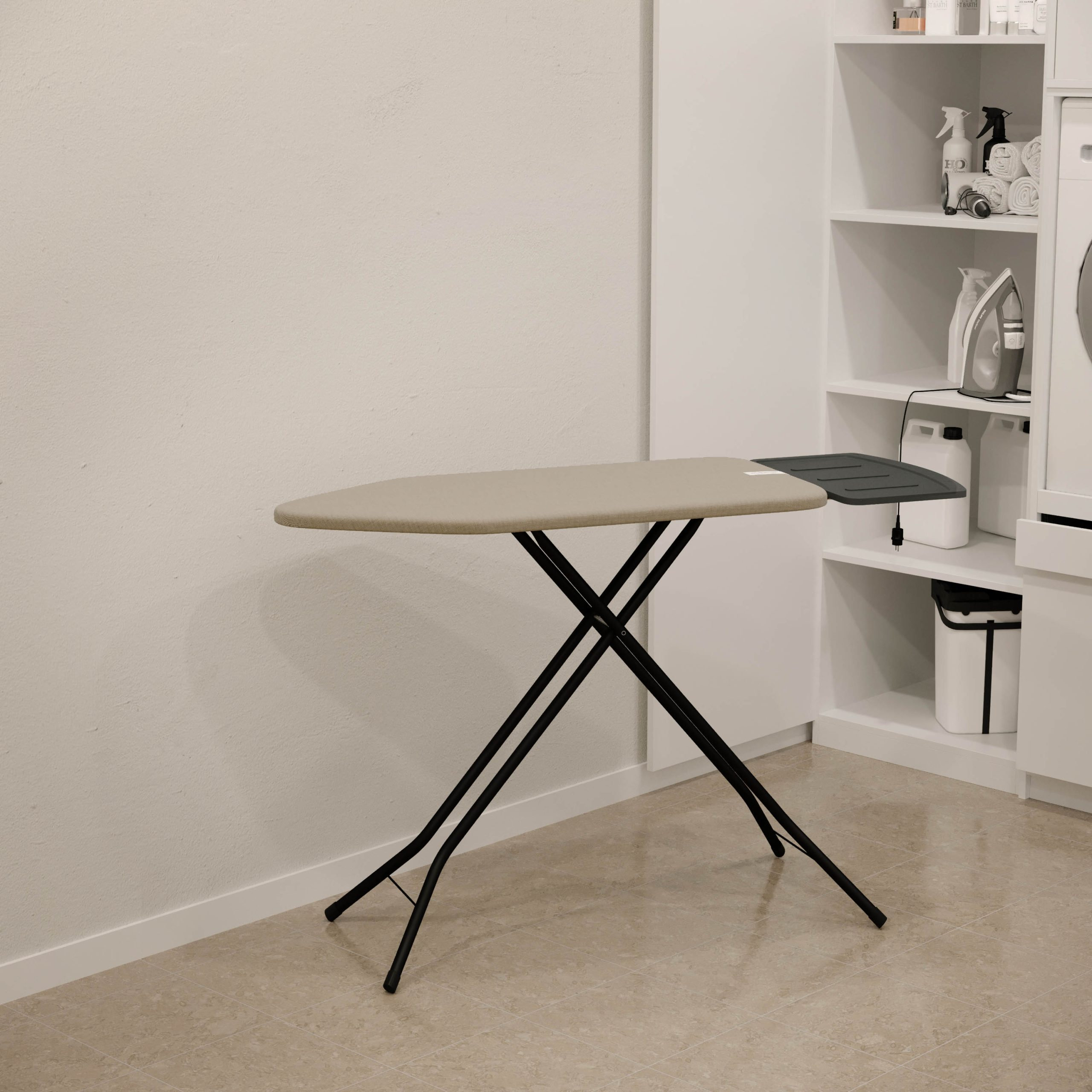 A grey ironing board with a black metal frame stands in a modern room in front of a shelf.