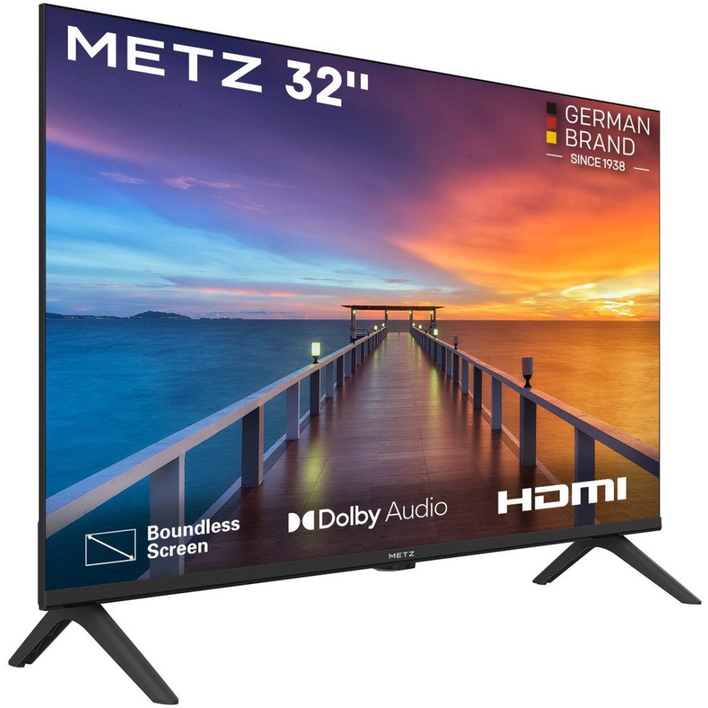 Telewizor Metz 32 cali z nóżkami w kształcie litery V wyświetla most nad wodą o zachodzie słońca.
