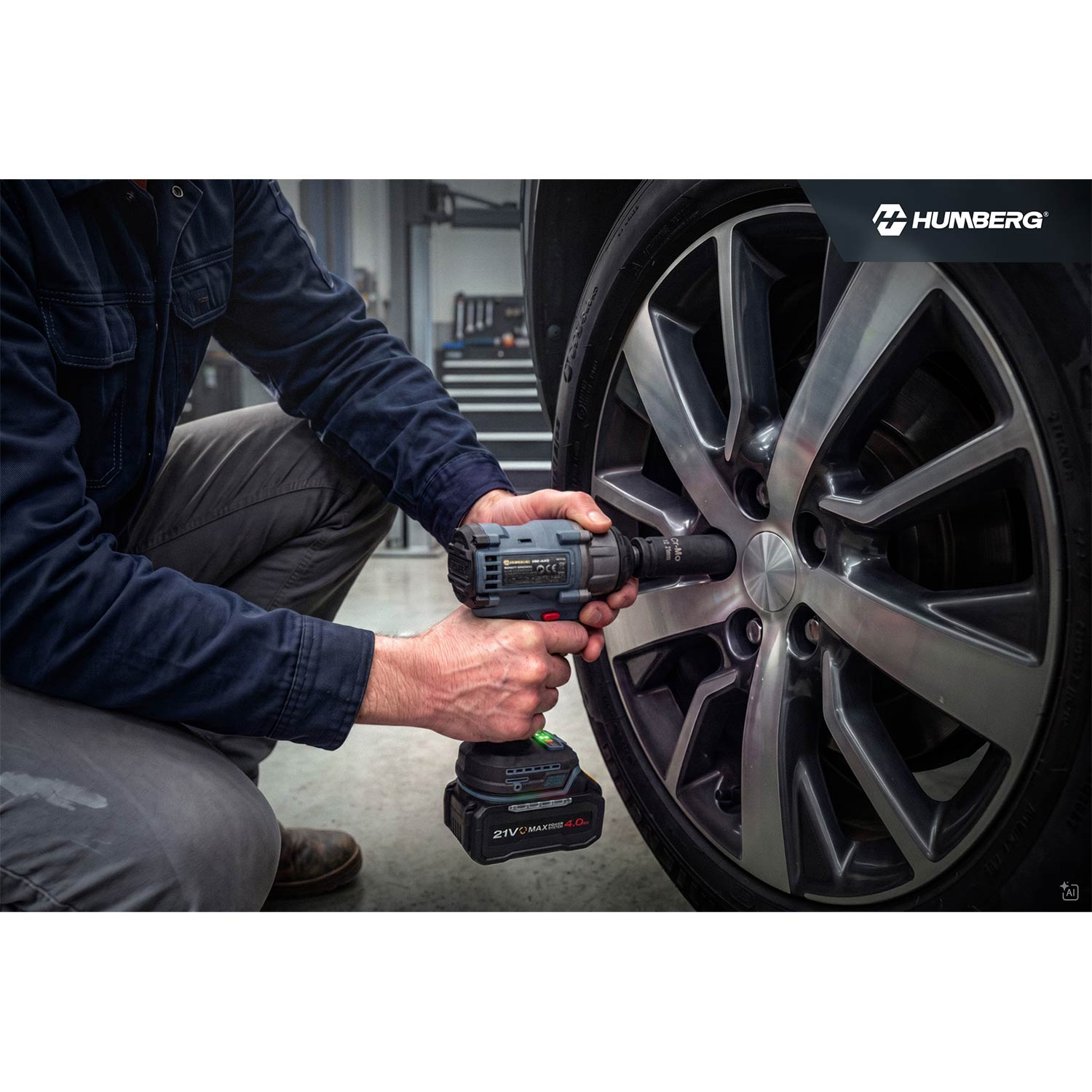 Mechanik używający akumulatorowego klucza udarowego do odkręcania śrub koła.