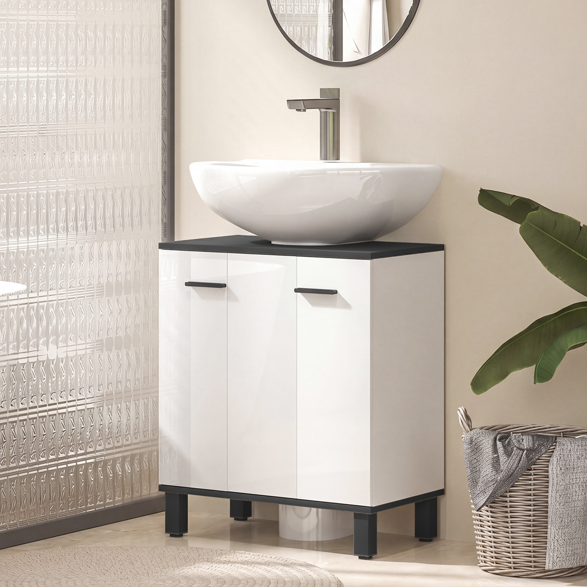 Mueble de baño moderno con lavabo blanco, espejo redondo y cesta con toalla.