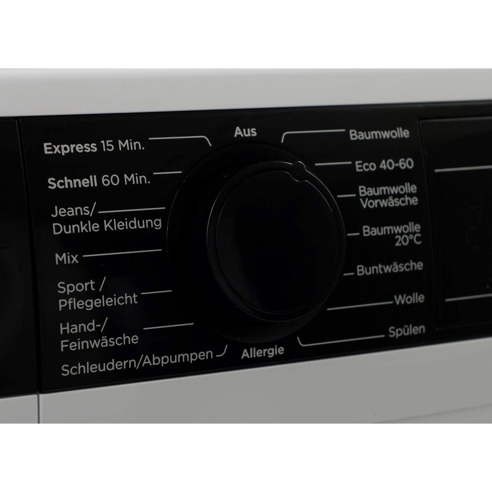 Gros plan d'un sélecteur de programme noir rond sur un lave-linge avec des étiquettes en allemand.