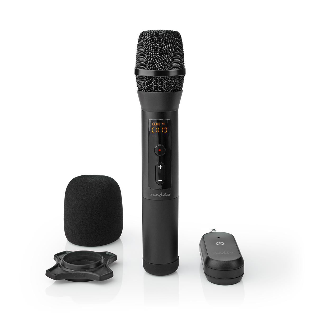 A black microphone with display, foam cover, stand, and small remote control against a white background.