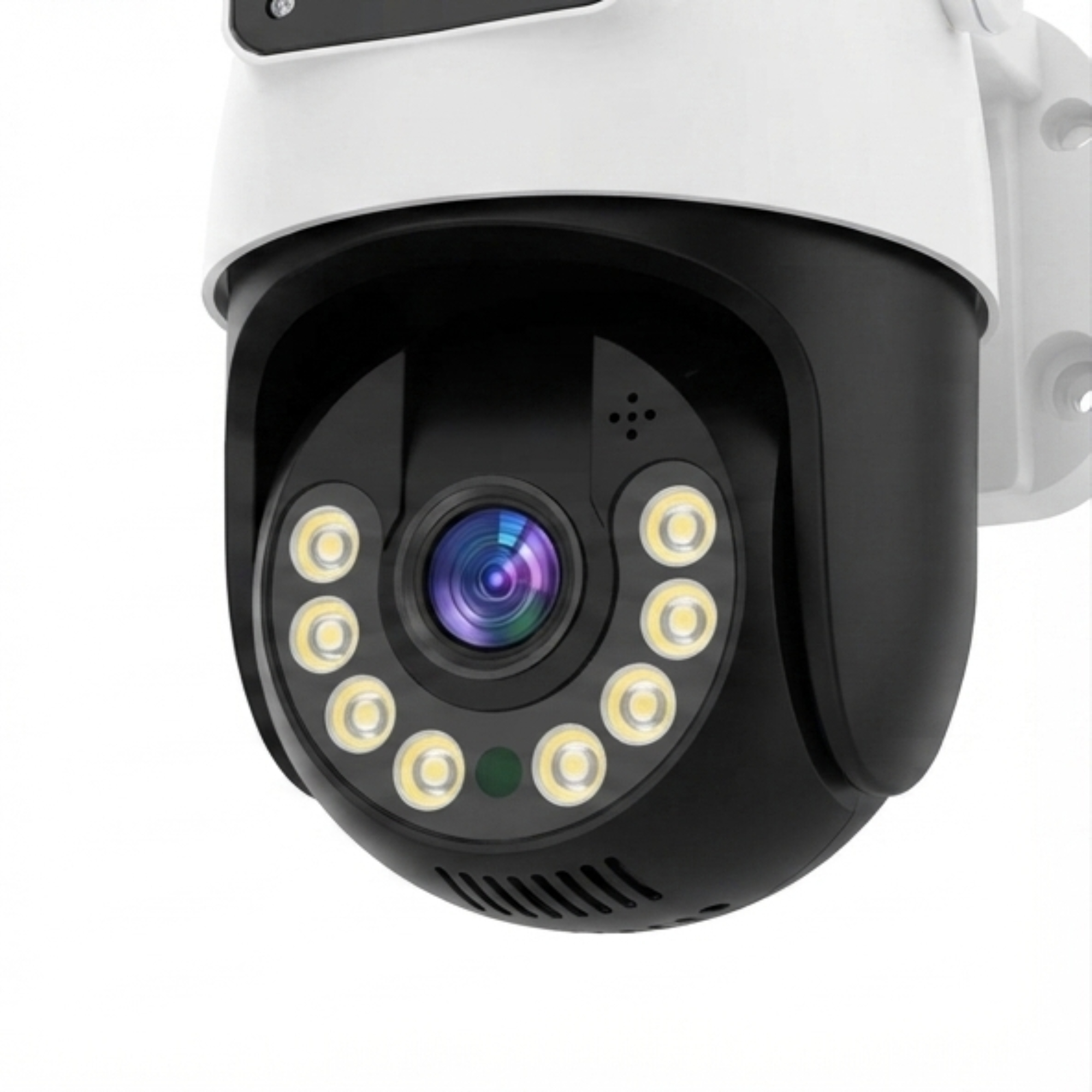 Una cámara de seguridad blanca y negra con lente central rodeada de diez pequeñas luces LED blancas en una pared.