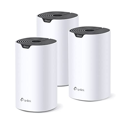 Tre router Wi-Fi mesh TP-Link Deco cilindrici bianchi su sfondo bianco.