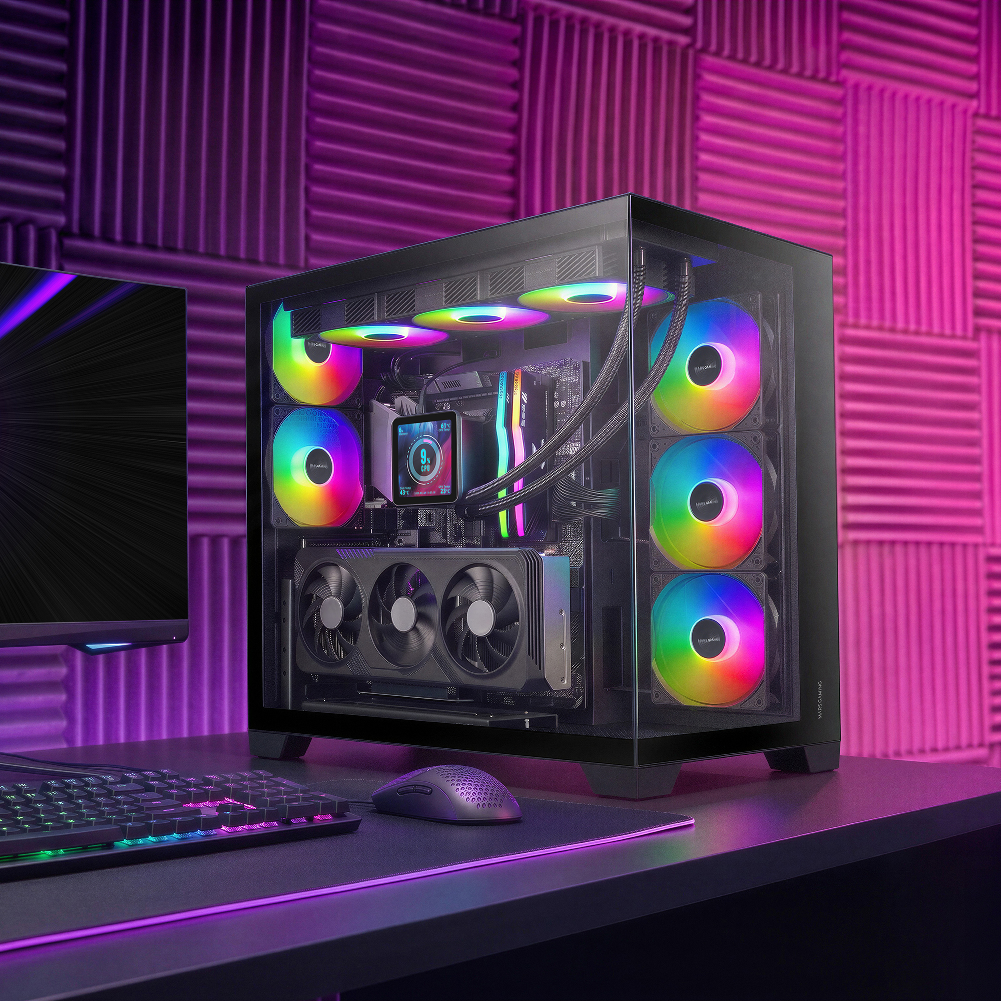 Un PC gaming con ventiladores RGB y refrigeración líquida está sobre un escritorio con fondo rosa.