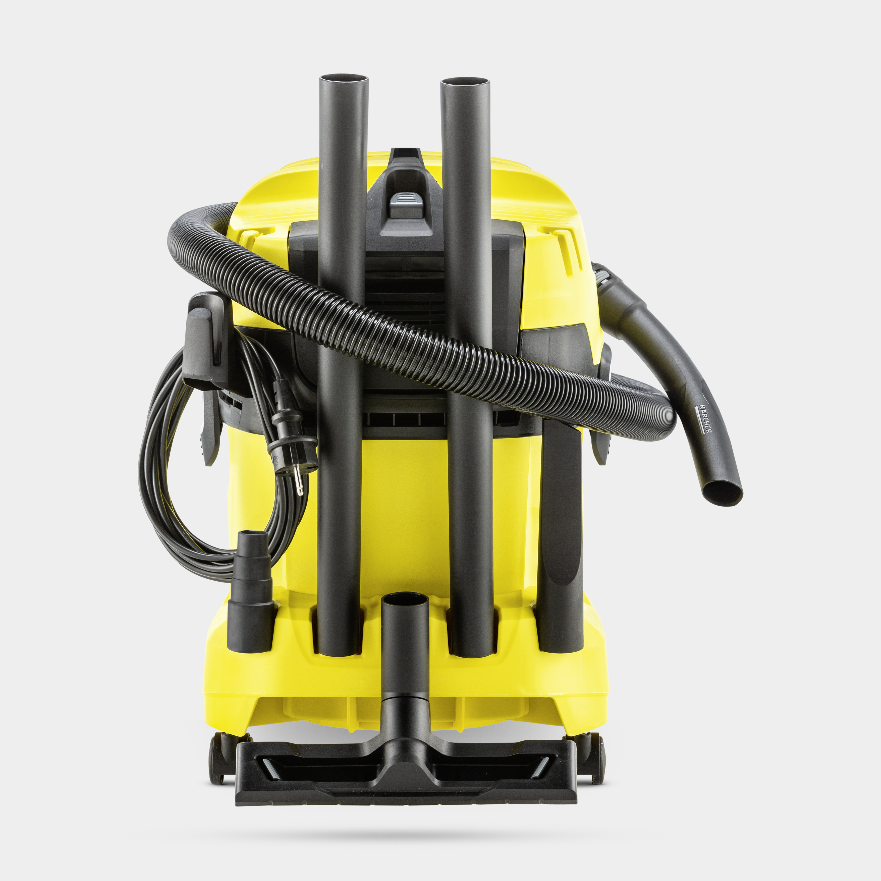 Aspirapolvere e liquidi giallo e nero con tubo flessibile e tubi riposti.
