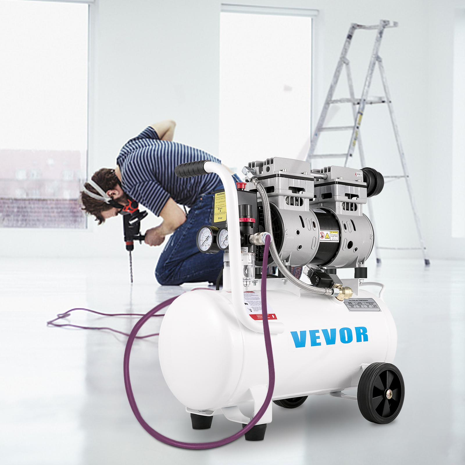 Un compresor de aire VEVOR blanco en primer plano con un trabajador perforando al fondo.