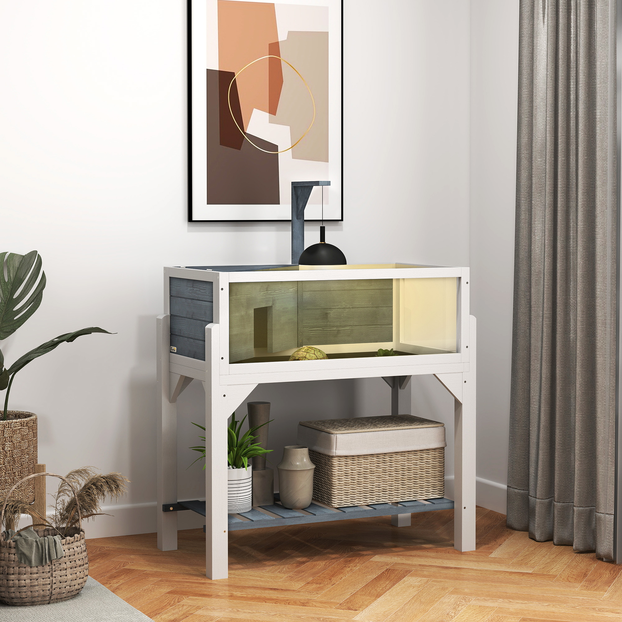 Un soporte para terrario de reptiles blanco con balda inferior, lámpara, tortuga y decoración.