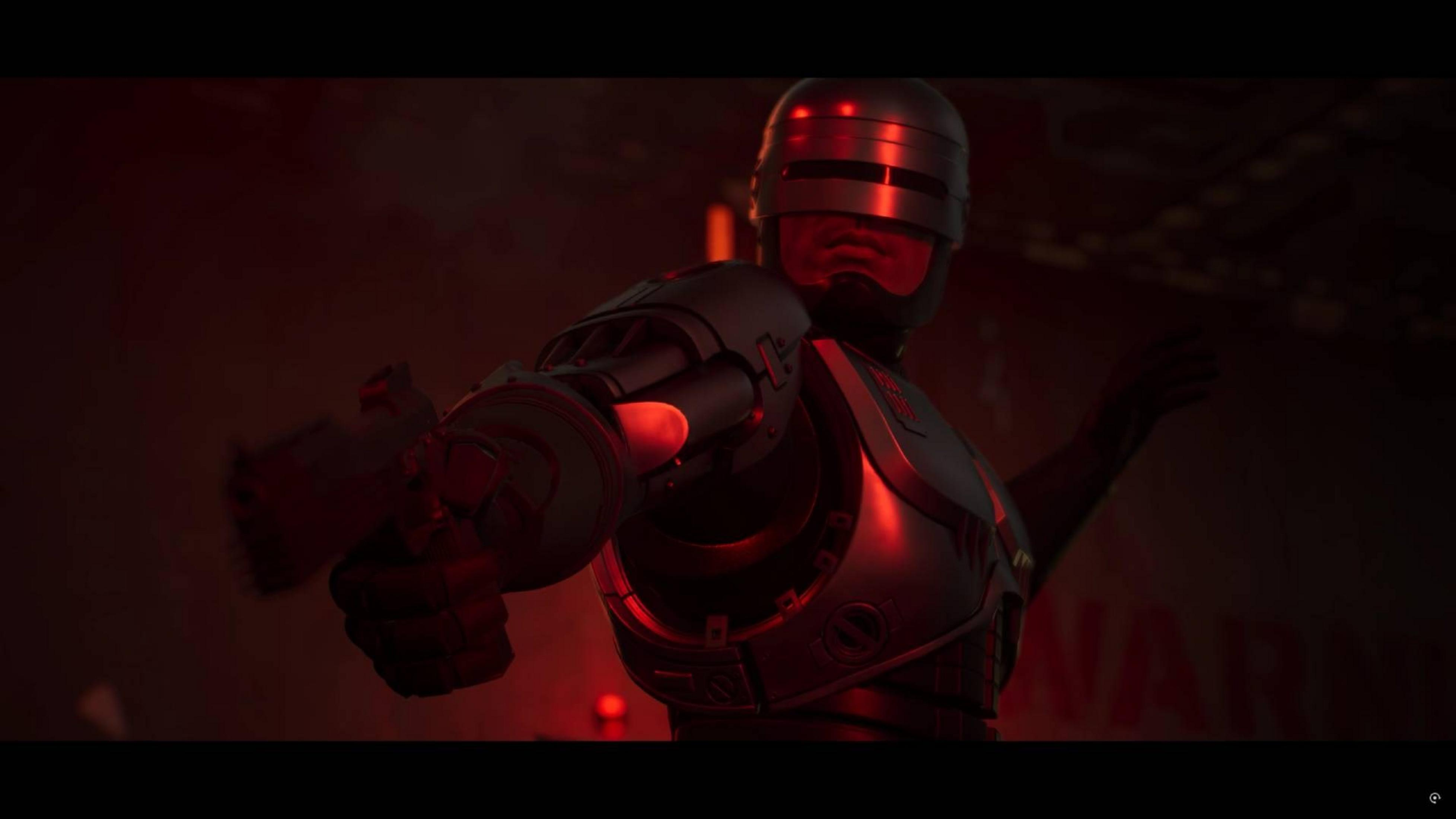 RoboCop zielt mit einer Waffe in rotem Licht.