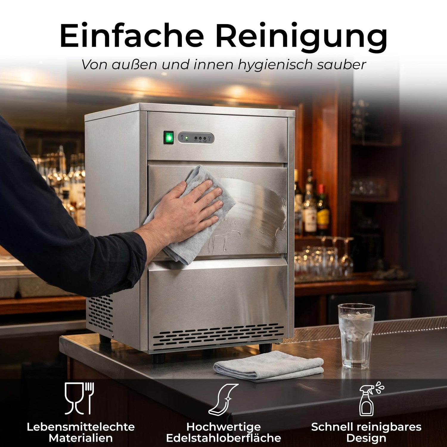 Eine Hand wischt die Edelstahloberfläche einer Eismaschine auf einer Bar sauber.