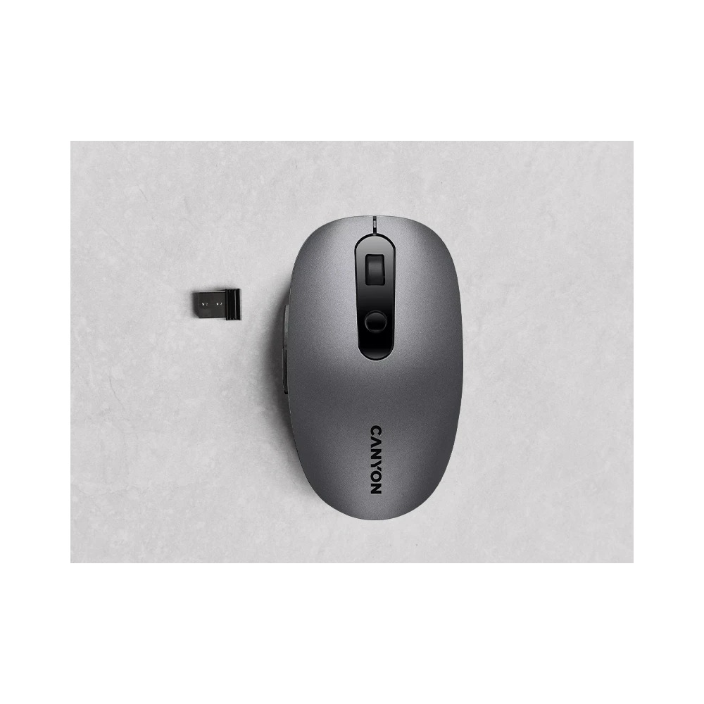 Szara mysz bezprzewodowa Canyon z odbiornikiem USB na jasnym tle.