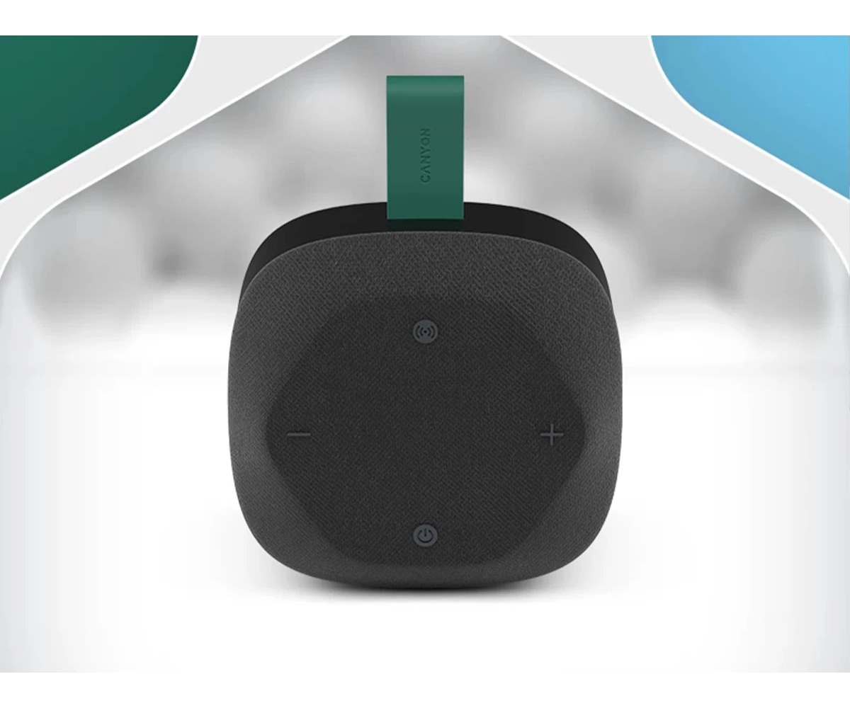 Czarny, kwadratowy głośnik Canyon z zielonym paskiem z tkaniny oraz symbolami głośności, zasilania i Bluetooth.