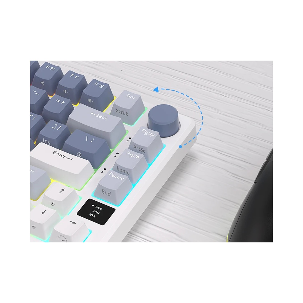 Primer plano de un teclado blanco y azul con retroiluminación arcoíris y un botón giratorio.