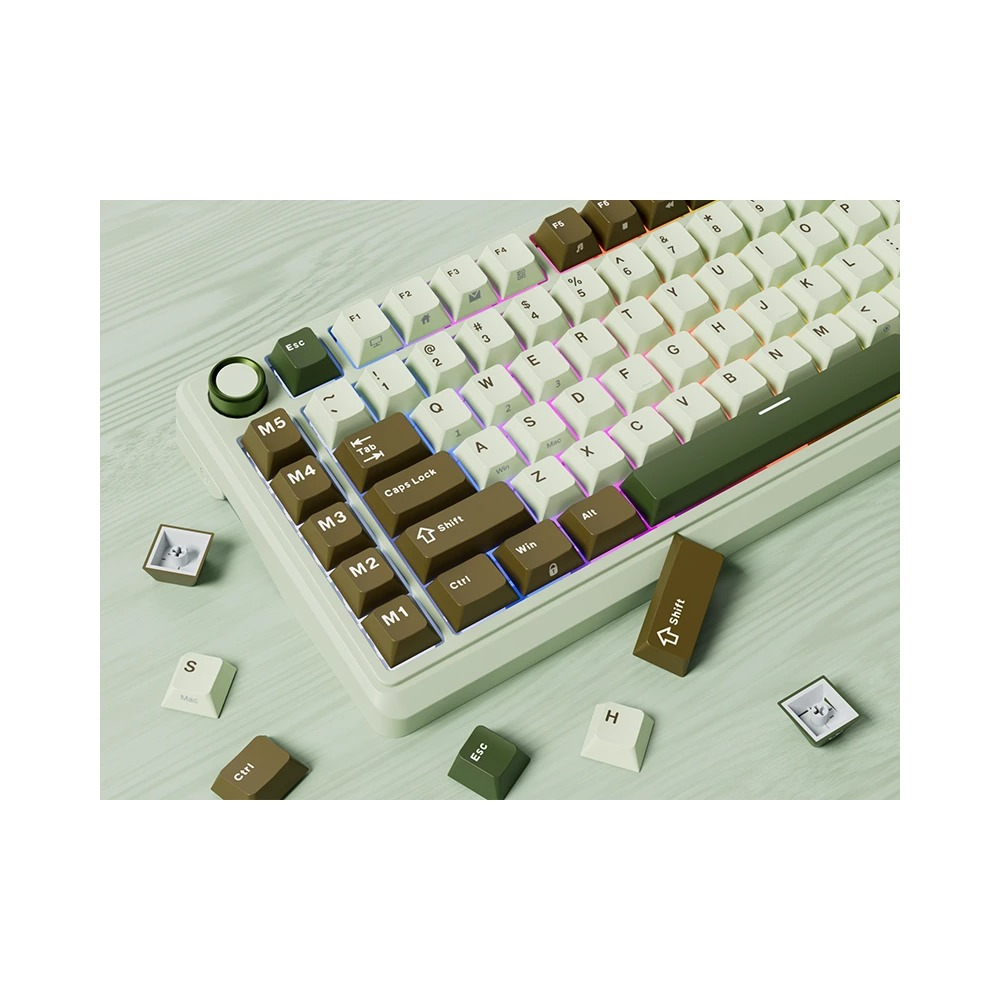 Zielono-biała klawiatura mechaniczna z oświetleniem RGB i osobnymi klawiszami na stole.