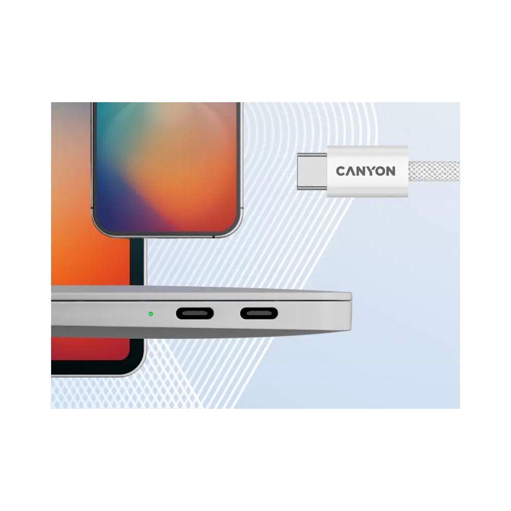 Kabel USB-C Canyon zbliża się do portów laptopa obok smartfona.