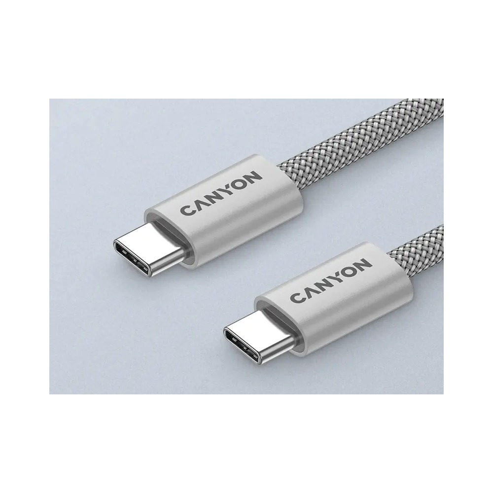 Dwa srebrne plecione kable USB-C marki Canyon na szarym tle.