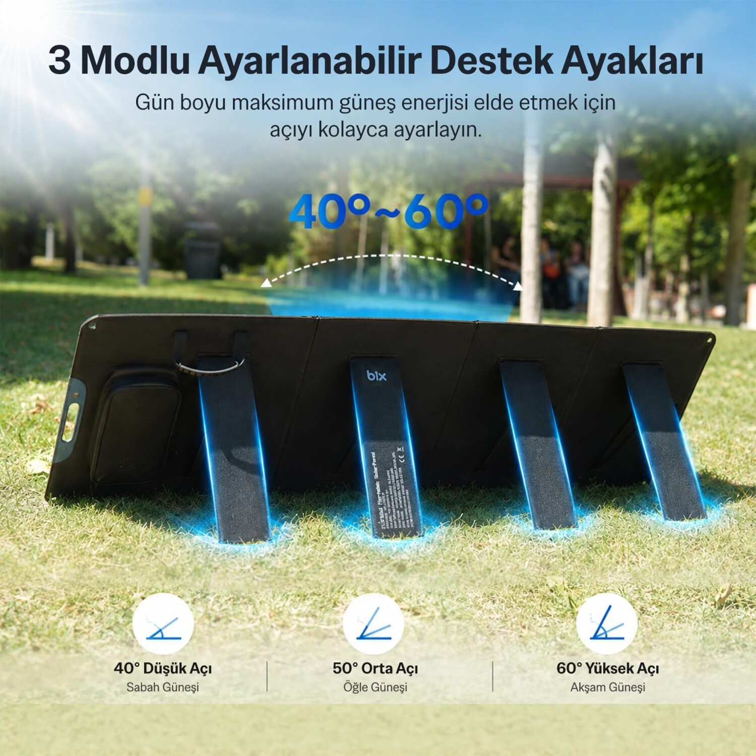 Çim üzerinde farklı açılara ayarlanabilir ayaklı taşınabilir güneş paneli.