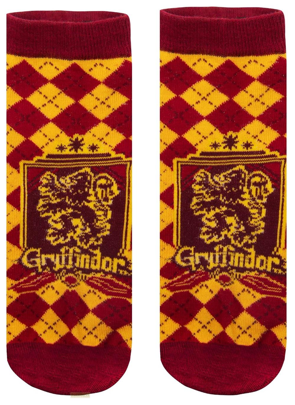 Dos calcetines rojos y dorados de Gryffindor con escudos en fondo blanco.